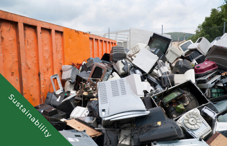 Waste electronics in large orange skip