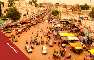 View of Indian city from above with cars and colourful stalls